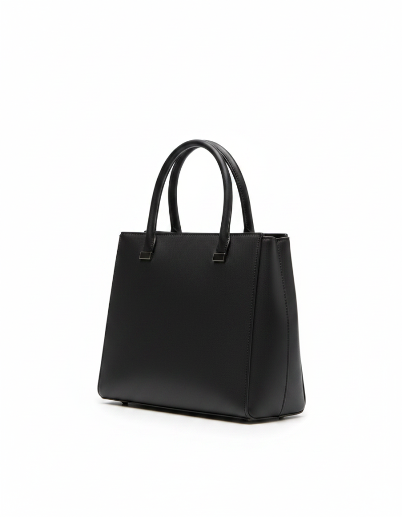 Handtasche: Schmal und strukturiert, dunkles Leder, kein Beschlag.