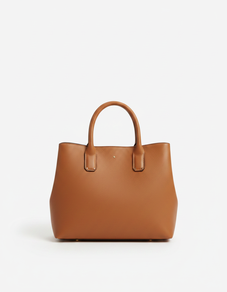 Handtasche: Karamellfarbenes Leder, strukturierte Form, breiter Henkel, weiche Narbung.